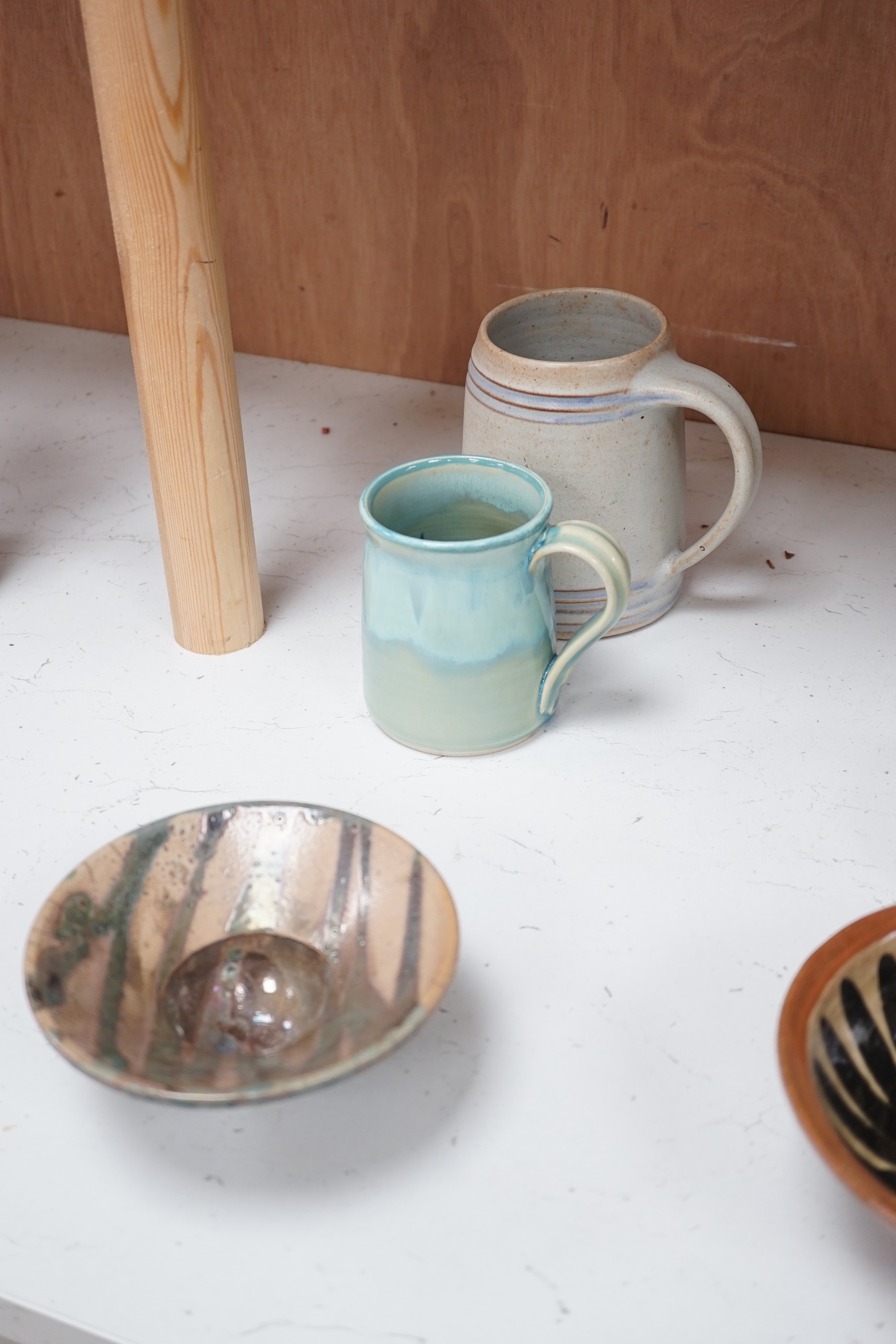 A group of European and Japanese studio pottery dishes, bowls and vases including a Boscastle R Irving plate, largest 26cm in diameter (17)